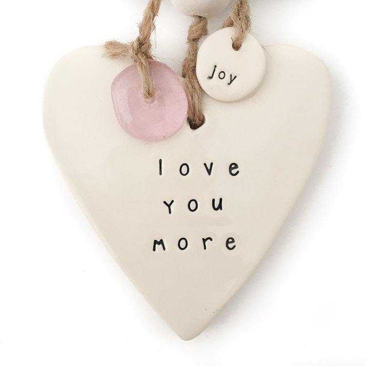 Handmade ceramic heart wall hanging 'love you more'