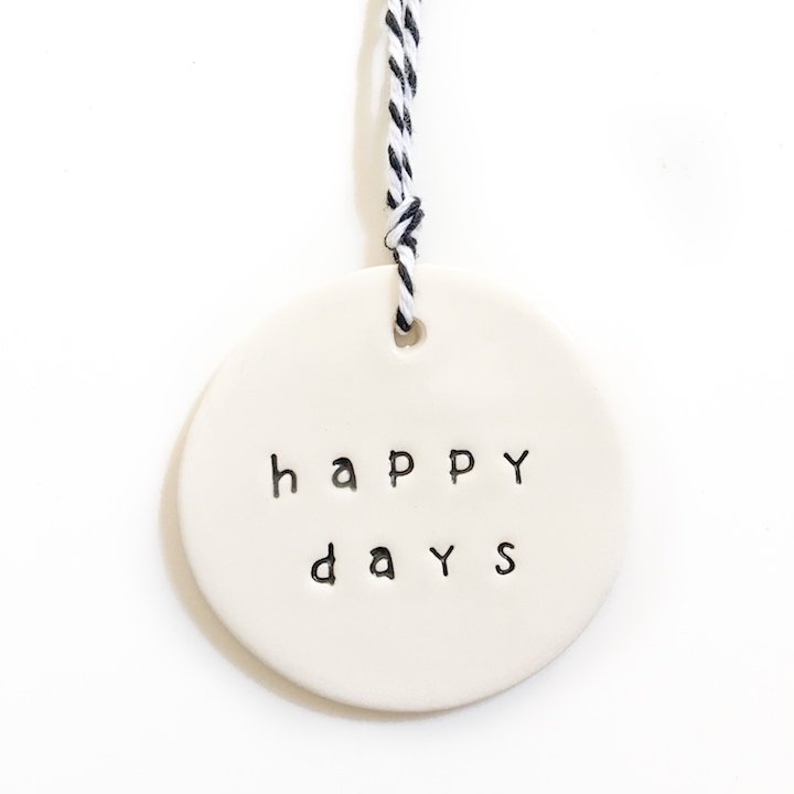 Handmade ceramic tag circle happy days